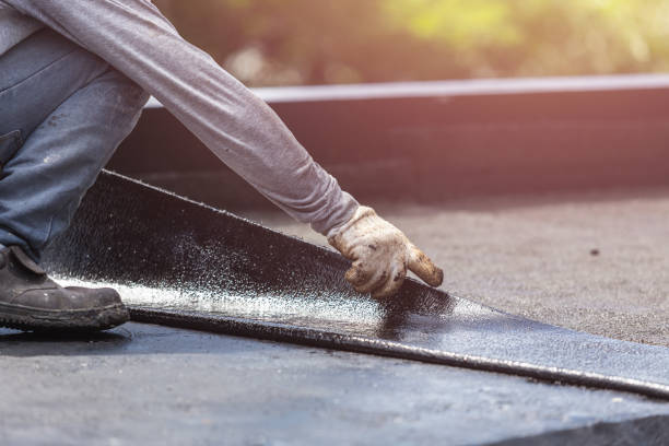Professional Waterproofing technician working in Oneonta, AL
